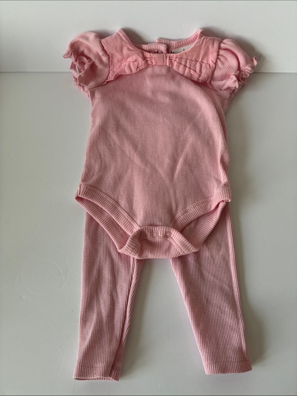 Nicole Miller Pink Ribbed One-Piece with Ruffle Shoulders